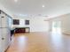 Open concept living space and kitchen with modern appliances and hardwood floors at 534 Stowers Dr, New Smyrna Beach, FL 32168