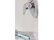 Close up of chrome shower head and faucet with white tile at 534 Stowers Dr, New Smyrna Beach, FL 32168