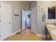 Well-lit bathroom with dual sinks, tile flooring, and ample space and storage at 535 Coral Trace Blvd, Edgewater, FL 32132