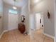 Spacious entryway featuring tile flooring and decorative accents leading to the living areas at 535 Coral Trace Blvd, Edgewater, FL 32132