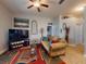 Cozy living room featuring a colorful rug, comfortable couch, and stylish decor at 535 Coral Trace Blvd, Edgewater, FL 32132