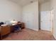 Office with carpeted floor, built-in desk, printer and storage, offering a practical workspace solution at 535 Coral Trace Blvd, Edgewater, FL 32132