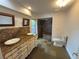 Elegant bathroom featuring granite countertops, dual sinks, and walk-in shower with slate-style tile at 547 Cleo Ln, Deltona, FL 32738