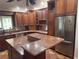 The kitchen features granite counters, stainless appliances and custom cabinetry at 547 Cleo Ln, Deltona, FL 32738