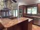 Kitchen includes a large island, granite countertops and stainless steel appliances at 547 Cleo Ln, Deltona, FL 32738