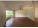 Bright living room offers a large window and tray ceilings at 547 Cleo Ln, Deltona, FL 32738