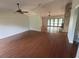 Spacious living room features hardwood floors and a ceiling fan at 547 Cleo Ln, Deltona, FL 32738