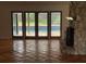 Living room has tile flooring and access to a pool through french doors at 547 Cleo Ln, Deltona, FL 32738