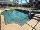 Screened-in pool and spa area featuring clean, clear water and a serene backyard setting at 547 Cleo Ln, Deltona, FL 32738