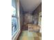 Walk-in shower showcasing slate tile, natural light, bench seating, and updated shower fixtures at 547 Cleo Ln, Deltona, FL 32738