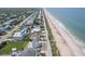 Aerial showcases location of these beach homes offering tranquil coastal lifestyle near community amenities and local attractions at 6320 S Atlantic Ave, New Smyrna Beach, FL 32169