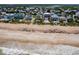 Aerial shot of coastal homes with private beach access, close to local amenities, and serene ocean views at 6320 S Atlantic Ave, New Smyrna Beach, FL 32169
