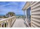Balcony with comfortable seating providing breathtaking views of the ocean and native palms at 6320 S Atlantic Ave, New Smyrna Beach, FL 32169