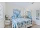 Bright bedroom featuring queen size bed, neutral walls and a closet with mirrored doors at 6320 S Atlantic Ave, New Smyrna Beach, FL 32169
