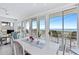 Dining area with views of the ocean and a sliding door to the deck at 6320 S Atlantic Ave, New Smyrna Beach, FL 32169