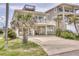 Charming beach house with covered parking and a viewing deck for enjoying ocean views at 6320 S Atlantic Ave, New Smyrna Beach, FL 32169