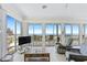 Cozy living area featuring stunning ocean views and comfortable seating for relaxation at 6320 S Atlantic Ave, New Smyrna Beach, FL 32169