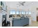 Open-concept living space with ocean views, a fireplace, and stylish furnishings at 6320 S Atlantic Ave, New Smyrna Beach, FL 32169