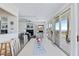 A living space adjacent to the dining area, with views of the ocean and access to the porch at 6320 S Atlantic Ave, New Smyrna Beach, FL 32169