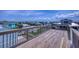 Spacious wooden roof deck with wooden railing offers expansive neighborhood views at 6320 S Atlantic Ave, New Smyrna Beach, FL 32169