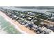 Aerial view of beachfront homes with private beach access and ocean views at 6871 S Atlantic Ave., New Smyrna Beach, FL 32169