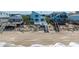 Charming beach house with private beach access, steps leading down to the sandy shore and ocean at 6871 S Atlantic Ave., New Smyrna Beach, FL 32169