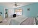 Cozy bedroom with tile floors, natural light, and ensuite bathroom access at 6871 S Atlantic Ave., New Smyrna Beach, FL 32169