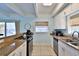 Bright kitchen with granite counters, modern appliances and views of the ocean and outdoor deck at 6871 S Atlantic Ave., New Smyrna Beach, FL 32169