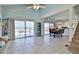 Bright living room with sliding glass doors leading to an outdoor deck with ocean views at 6871 S Atlantic Ave., New Smyrna Beach, FL 32169