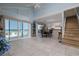 Bright and airy living space with tile flooring and access to an outdoor deck with ocean views at 6871 S Atlantic Ave., New Smyrna Beach, FL 32169