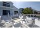 Expansive outdoor seating area with plush patio furniture, perfect for relaxing or entertaining at 6871 S Atlantic Ave., New Smyrna Beach, FL 32169