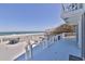 White deck with seating area overlooking the ocean at 6871 S Atlantic Ave., New Smyrna Beach, FL 32169