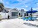 Backyard featuring a refreshing pool, tropical landscaping, and a patio area perfect for entertaining at 7 Heather Ln, Ormond Beach, FL 32174