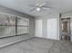 Cozy bedroom featuring neutral carpet, a ceiling fan, and bright natural light at 7 Heather Ln, Ormond Beach, FL 32174