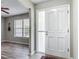 An inviting foyer features vinyl floors, a decorative front door, and neutral-colored walls at 7 Heather Ln, Ormond Beach, FL 32174