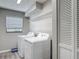 Functional laundry room with modern appliances and ample storage at 7 Heather Ln, Ormond Beach, FL 32174