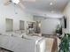 Spacious living room with vaulted ceilings, a fireplace and wood-look floors at 7 Heather Ln, Ormond Beach, FL 32174