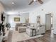 Expansive living room with a fireplace, vaulted ceilings, and an oversized sofa at 7 Heather Ln, Ormond Beach, FL 32174