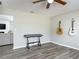 Bright living room featuring wood-look floors, guitars and keyboard at 7 Heather Ln, Ormond Beach, FL 32174