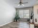 Inviting living room with a window, plants, fireplace and wood-look flooring at 7 Heather Ln, Ormond Beach, FL 32174