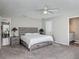 Comfortable main bedroom with wood furniture, carpeting, and en suite bathroom access at 7 Heather Ln, Ormond Beach, FL 32174