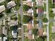 A home surrounded by mature trees and lush landscaping, with easy access to nearby streets at 708 Egret Ct, Edgewater, FL 32141