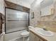 This bathroom has an updated vanity and a shower with sliding glass doors at 708 Egret Ct, Edgewater, FL 32141