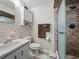 Charming bathroom with floral wallpaper, shower, and vanity, creating a warm and inviting space at 708 Egret Ct, Edgewater, FL 32141