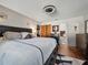 Warm bedroom space with dark wood bed frame, ensuite bathroom, and modern ceiling fan at 708 Egret Ct, Edgewater, FL 32141