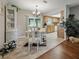 Inviting dining area with chandelier, sliding glass doors, and decorative china cabinet at 708 Egret Ct, Edgewater, FL 32141