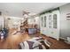 Relaxing living room area with hardwood floors, neutral color scheme, and easy access to the dining area at 708 Egret Ct, Edgewater, FL 32141