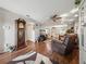 Open-concept living room featuring hardwood floors, ample space, neutral colors, and a smooth transition to the dining area at 708 Egret Ct, Edgewater, FL 32141