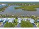 Aerial view of waterfront homes with private docks, boat slips and waterfront residences at 76 Heather Point Ct, New Smyrna Beach, FL 32169