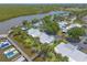 Scenic waterfront condos featuring boat docks in a tranquil setting surrounded by lush greenery and serene waterways at 76 Heather Point Ct, New Smyrna Beach, FL 32169